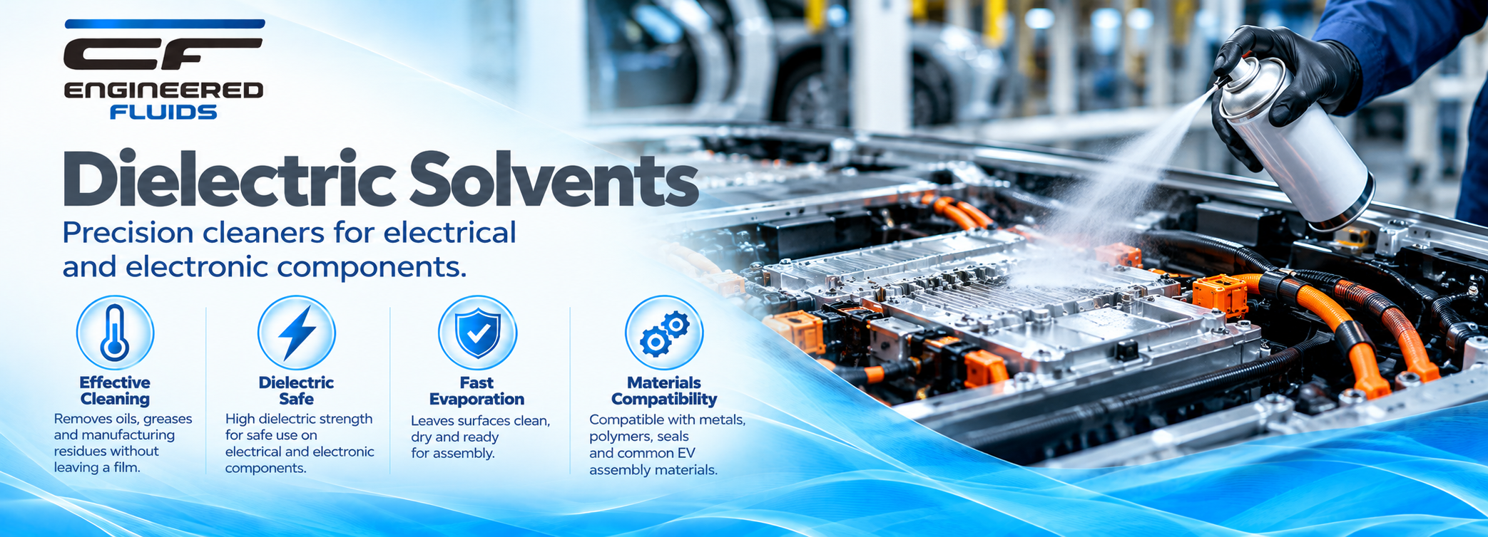 Dielectric solvents for electrical/electronic components with a worker spraying a cleaning solution on a battery assembly.